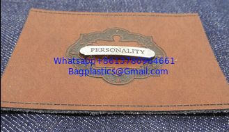China Customized embossed fake leather patch label or imitation leather tags for jeans, men jackets and apparel supplier